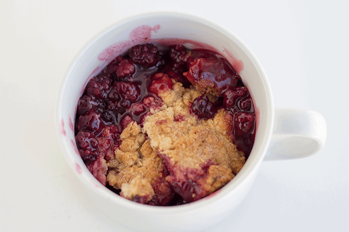 homemade cobbler with fresh blackberries served in a white mug