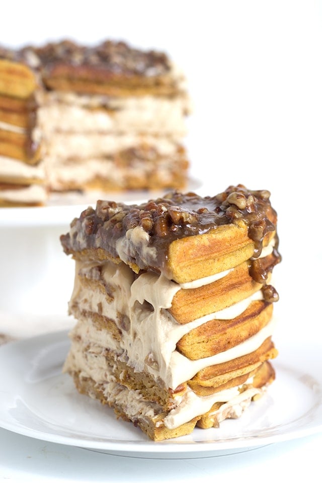 Pumpkin Pie Waffle Cake with a butter pecan glaze - spicy pumpkin waffles that are filled with a maple buttercream and topped with a butter bourbon pecan glaze. 