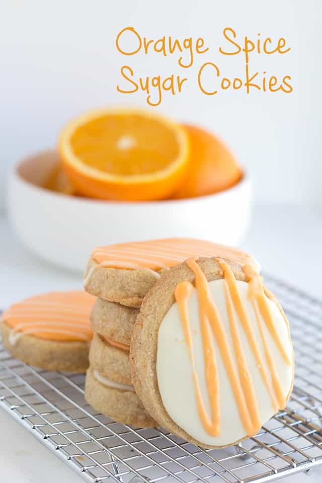 Orange Spice Sugar Cookies - These cookies have specks of cinnamon and orange zest throughout them. They make the perfect freezer cookie. I topped my orange spice cookies with an orange flavored royal icing to give it an extra punch of flavor.