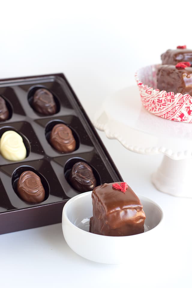 Chocolate Strawberry Petit Fours - strawberry and milk chocolate ganache layered tiny chocolate cakes that are perfect for the gift giving holiday!