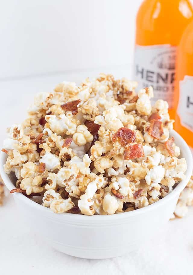 Maple Bacon Popcorn - Sweet and buttery maple coated popcorn with bits of crunchy, salty bacon. It's the perfect sweet and salty snack!