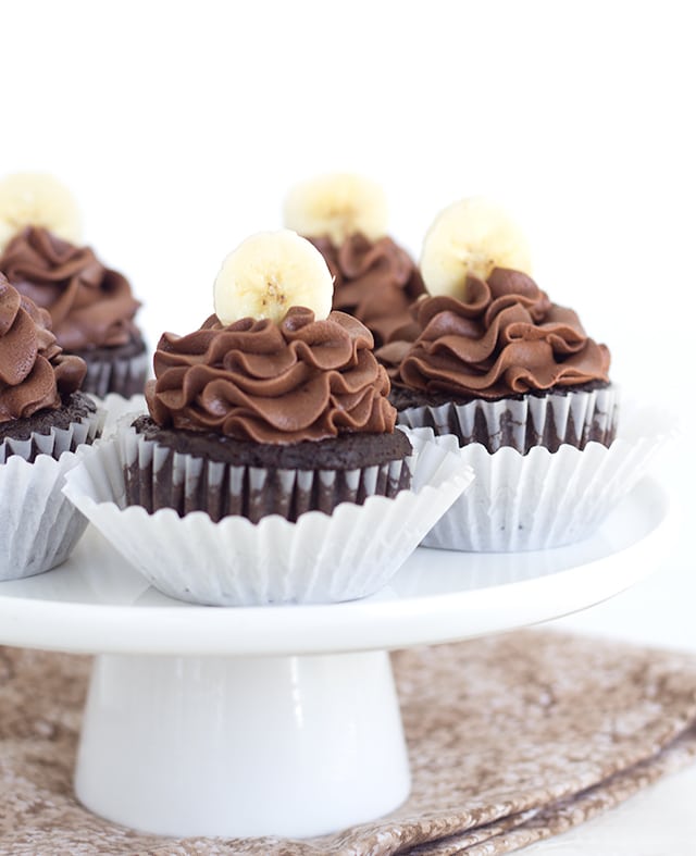 Chocolate Banana Cupcakes with a chocolate frosting and topped with a fresh banana slice!