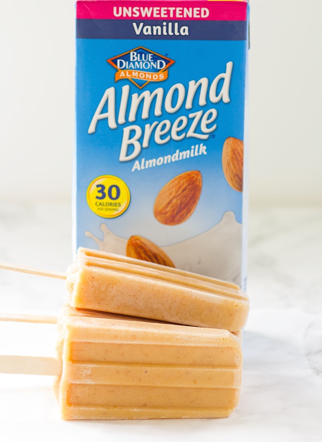 Peaches and Cream Ice Pops - lightly sweetened ice pops with roasted peaches and almond milk!