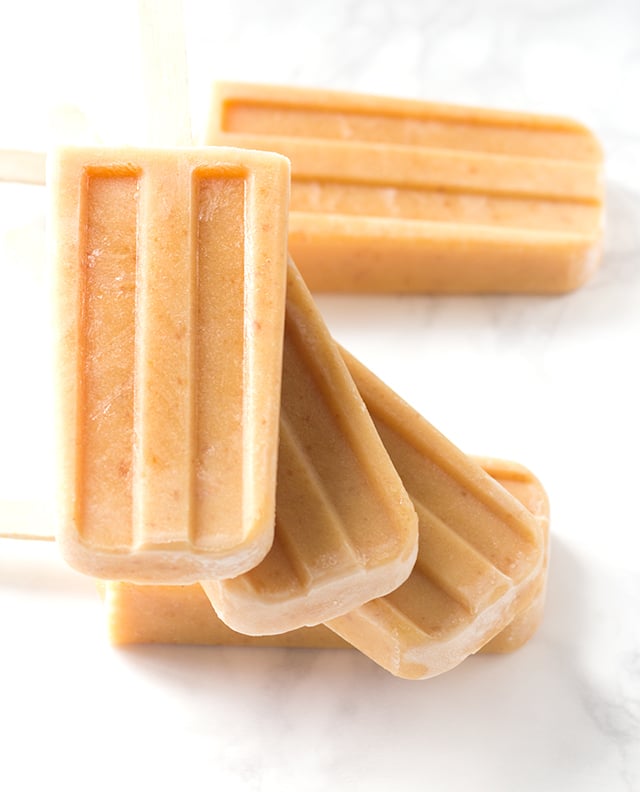 Peaches and Cream Ice Pops - lightly sweetened ice pops with roasted peaches and almond milk!