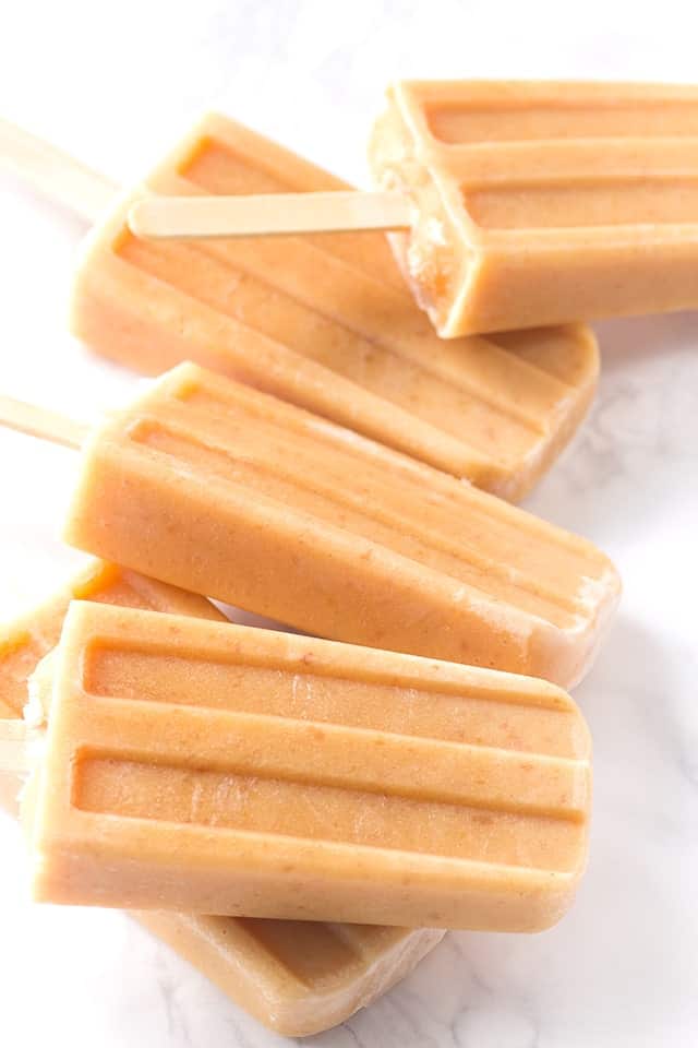 Peaches and Cream Ice Pops - lightly sweetened ice pops with roasted peaches and almond milk!