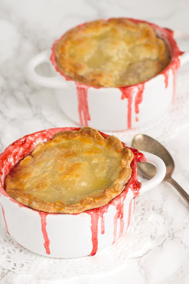 Strawberry Pot Pies - Sweet syrupy strawberry pot pies topped with a cream cheese pie crust. 