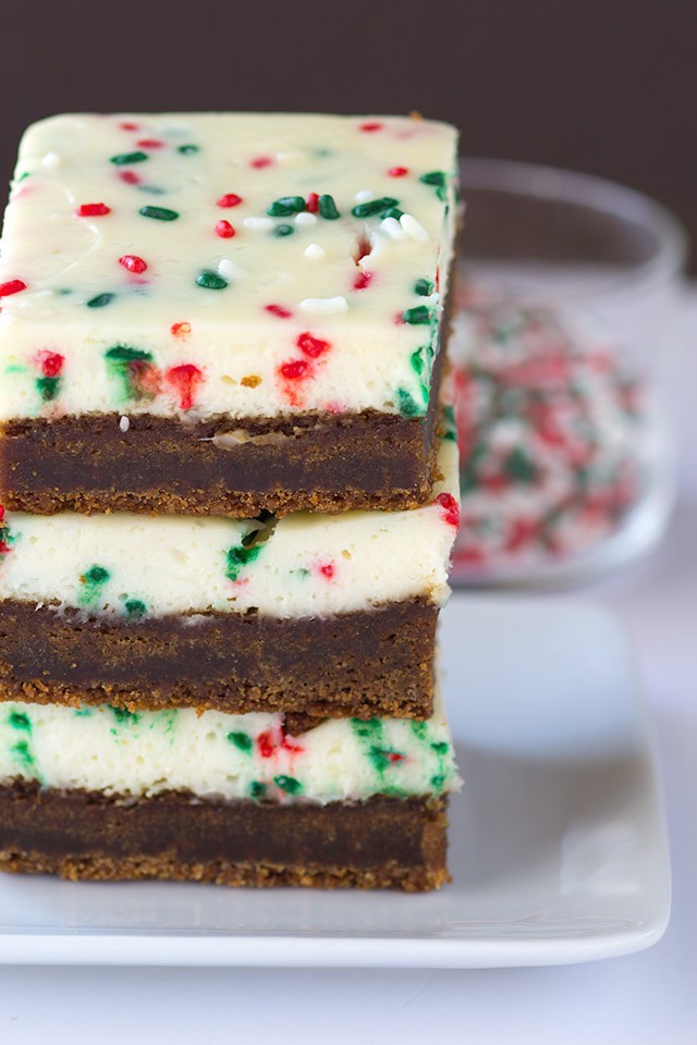 Molasses Cheesecake Bars - a dense and soft molasses cookie layer with a festive sprinkle packed cheesecake top.